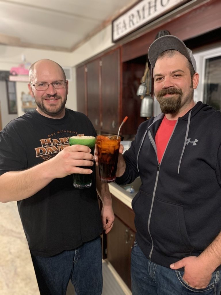 Employees holding a glass of drinks